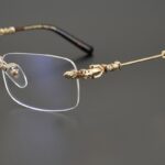 chrome hearts gold rimless cross glasses